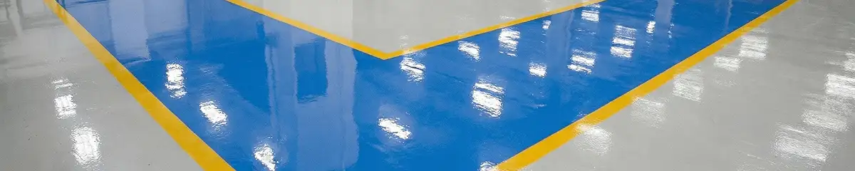 A factory floor professionally covered and marked with epoxy flooring in Raleigh, NC