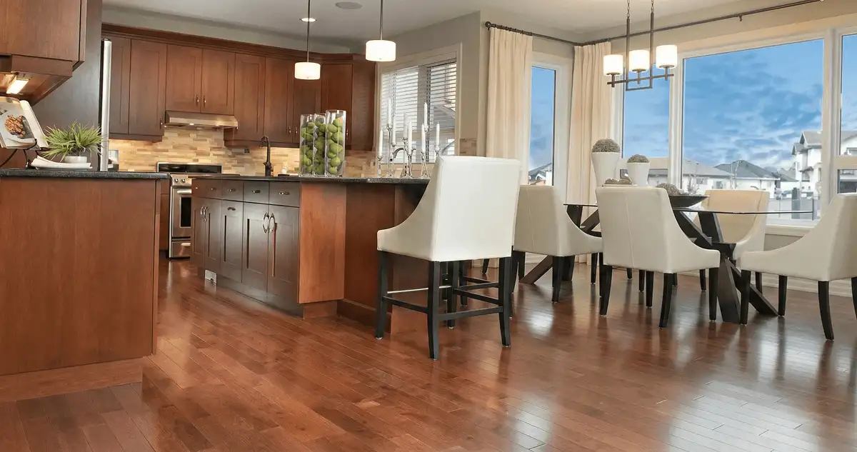 A modern kitchen with professionally installed wood flooring in Raleigh, NC