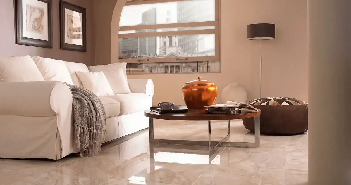 Modern living room with professionally installed marble flooring, a beige sofa, coffee table in Raleigh, NC